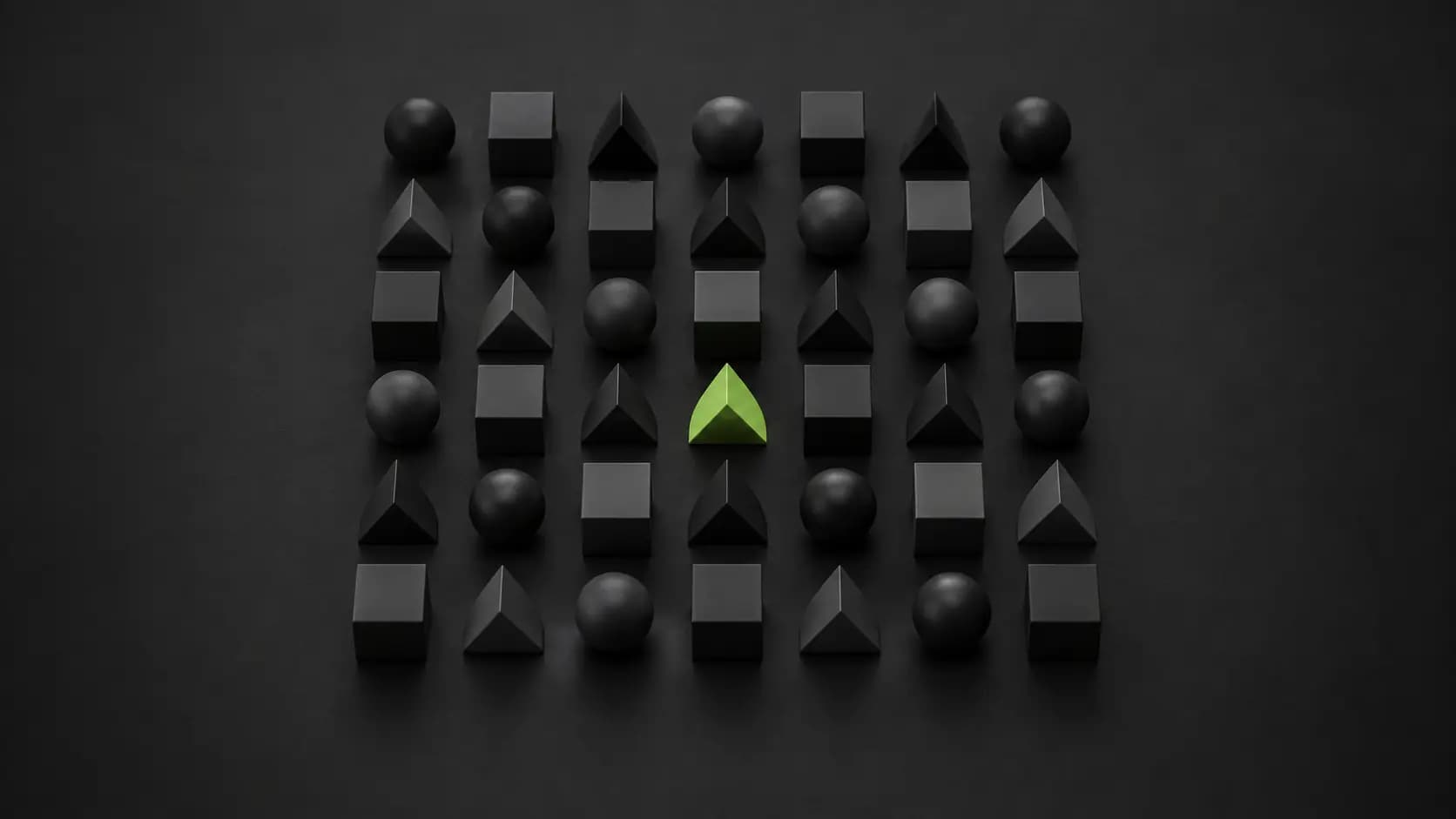 A grid of black geometric shapes with a single lime-green triangle